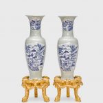 A pair of massive celadon glazed vases with underglaze blue landscape reserves 20th Century