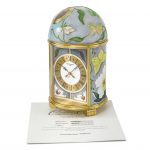 Patek Philippe. A very fine and attractive unique gilt brass solar-powered table clock with cloisonne enamel by L. Rhee and certificate