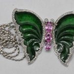 18k white gold butterfly brooch, featuring jade, pink sapphires, and diamonds