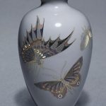 Cloisonne enamel vase decorated with butterflies.
