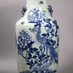 Chinese Qing Dynasty Celadon Porcelain Vase with a design of a Phoenix, Peonies, and Butterflies in underglaze Blue