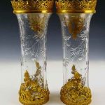 A pair of unsigned Baccarat French cut crystal vases with floral designs