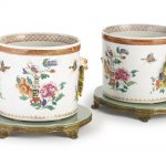 A pair of Chinese Export porcelain famille rose jardinières and mounted ormolu stands the porcelain circa 1740