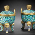 A pair of cloisonné enamel tripod incense burners and covers, ding Qianlong