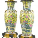 A large pair of Chinoiserie gilt and patinated bronze mounted Chinese export porcelain vases, mounted as oil lamps France, late 19th/early 20th century