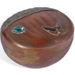 An enamel and copper 'chestnut' box and cover