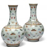 A PAIR OF FAMILLE ROSE BUTTERFLY BOTTLE VSES GUANGXU SIX-CHARACTER MARKS IN IRON-RED AND OF THE PERIOD (1875-1908)