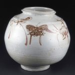 Storage jar of porcelain, decorated with flowers and butterflies in copper red pigment under clear glaze
