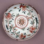 Porcelain dish. Decorated in overglaze green, yellow, red and brown enamels