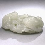 A white jade 'cat and butterfly' group Qing Dynasty, Qianlong period