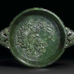A FINELY CARVED SPINACH-GREEN JADE 'MARRIAGE BOWL'