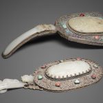 Two jade-mounted metal hand mirrors